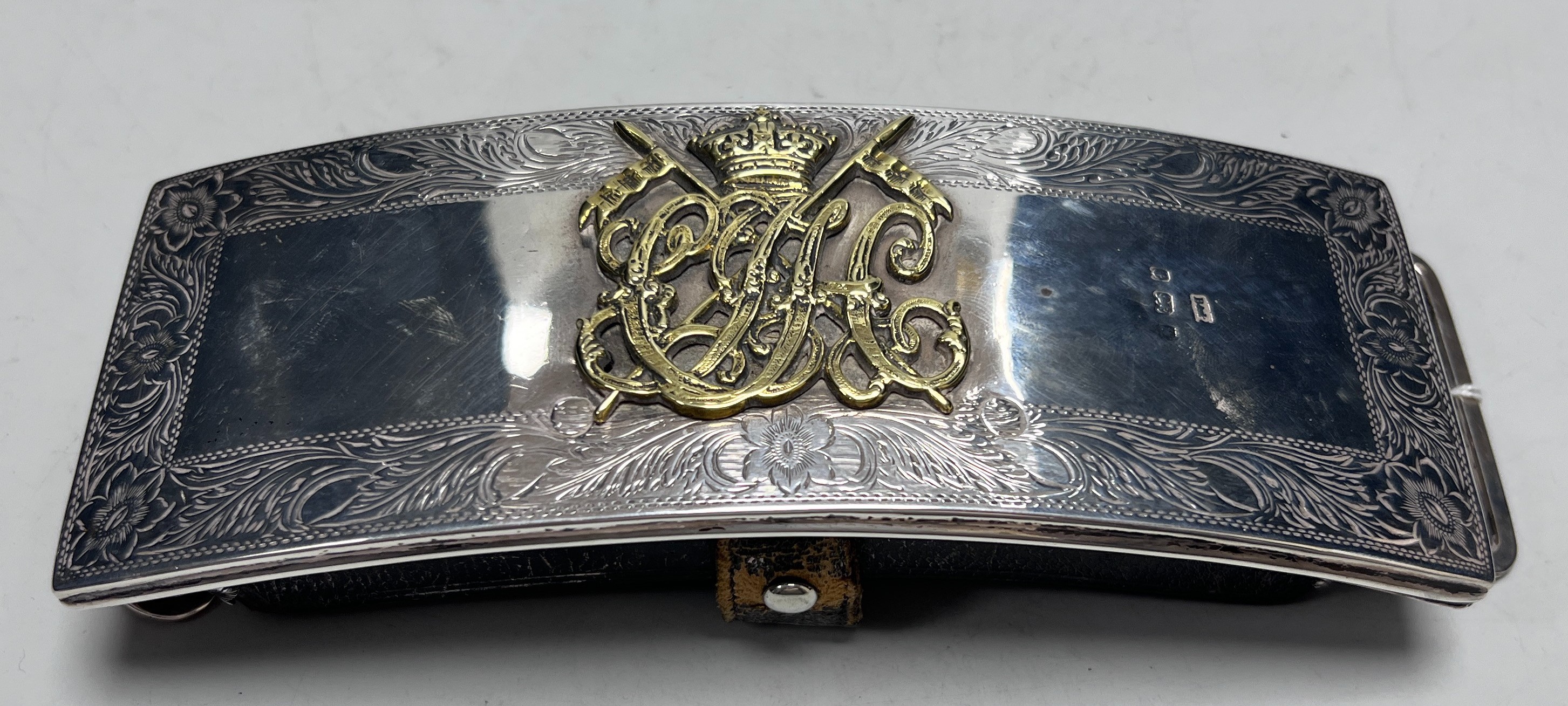 A late Victorian silver mounted leather ammunition pouch, with monogrammed applique, 18cm.